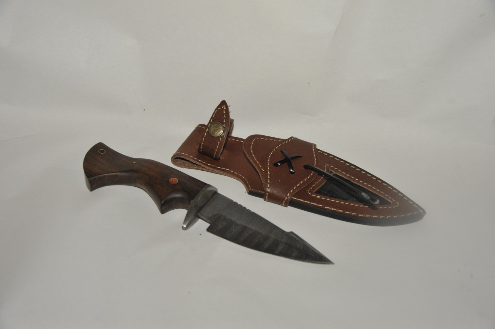 Alzafash handmade knife with damaskas steel Blade with rosewood handle.