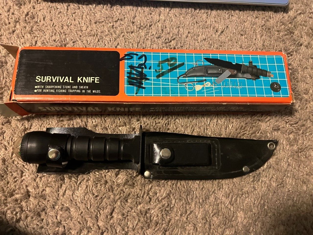 Survival knife with sharpening stone and sheath for hunting and fishing trapping