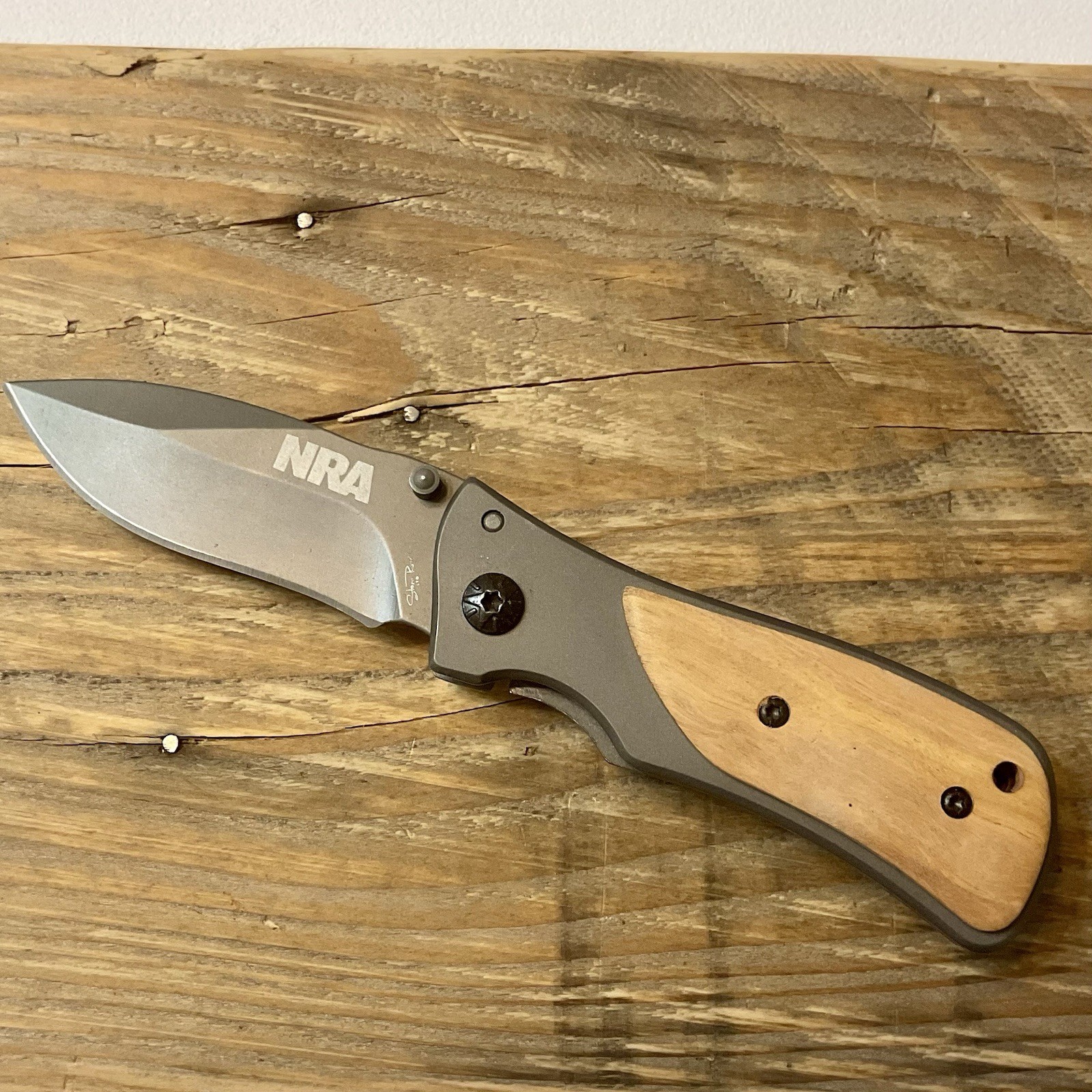 NRA Stone River Frame Lock Folding Knife with Pocket Clip Two Tone Wood Handle
