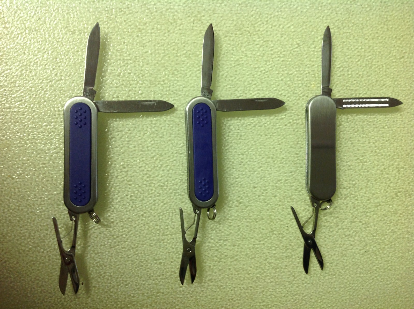 Lot of 3 pcs. 3 Function Pocket Knives, 2 Stainless/Purple, 1 Stainless, China