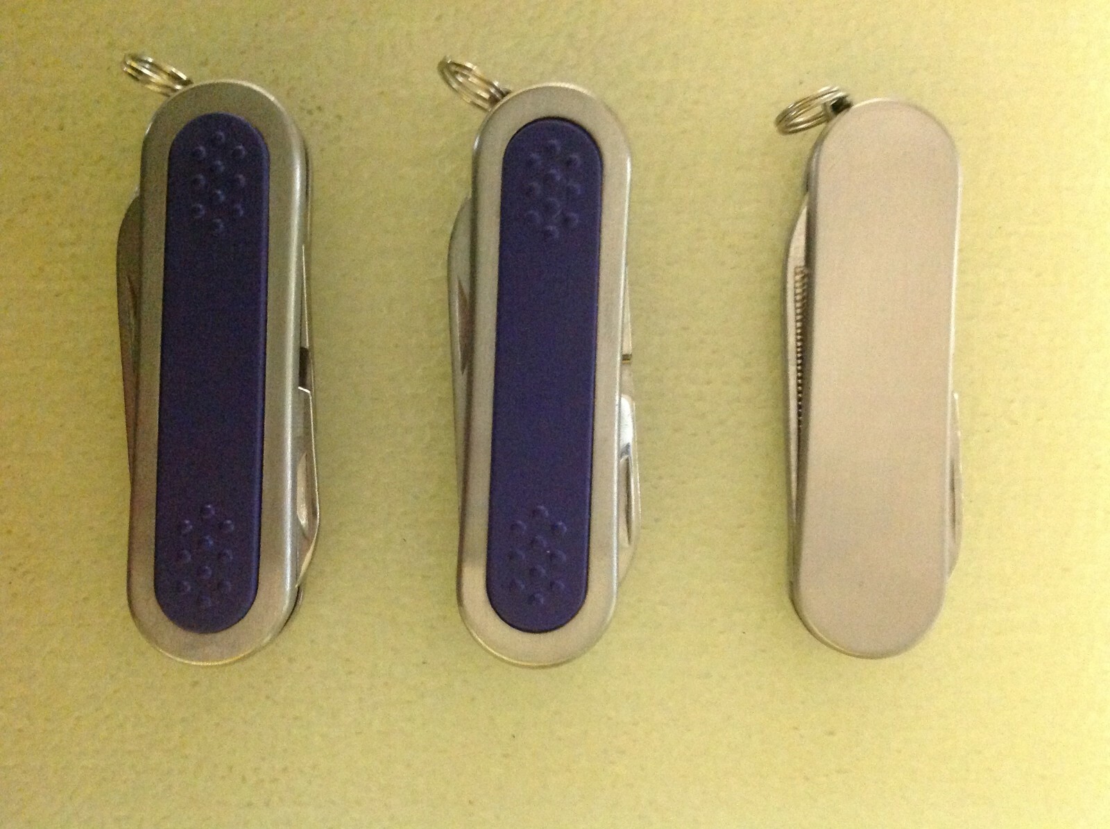 Lot of 3 pcs. 3 Function Pocket Knives, 2 Stainless/Purple, 1 Stainless, China
